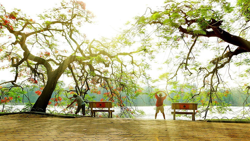 Locals doing exercise around Hoan Kiem Lake