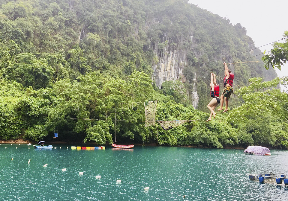 Having fun with zip line in Nuoc Mooc - Phong Nha Ke Bang National Park