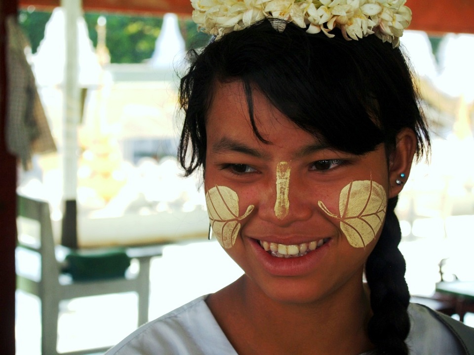 Myanmar girls with traditional Thanaka on their faces