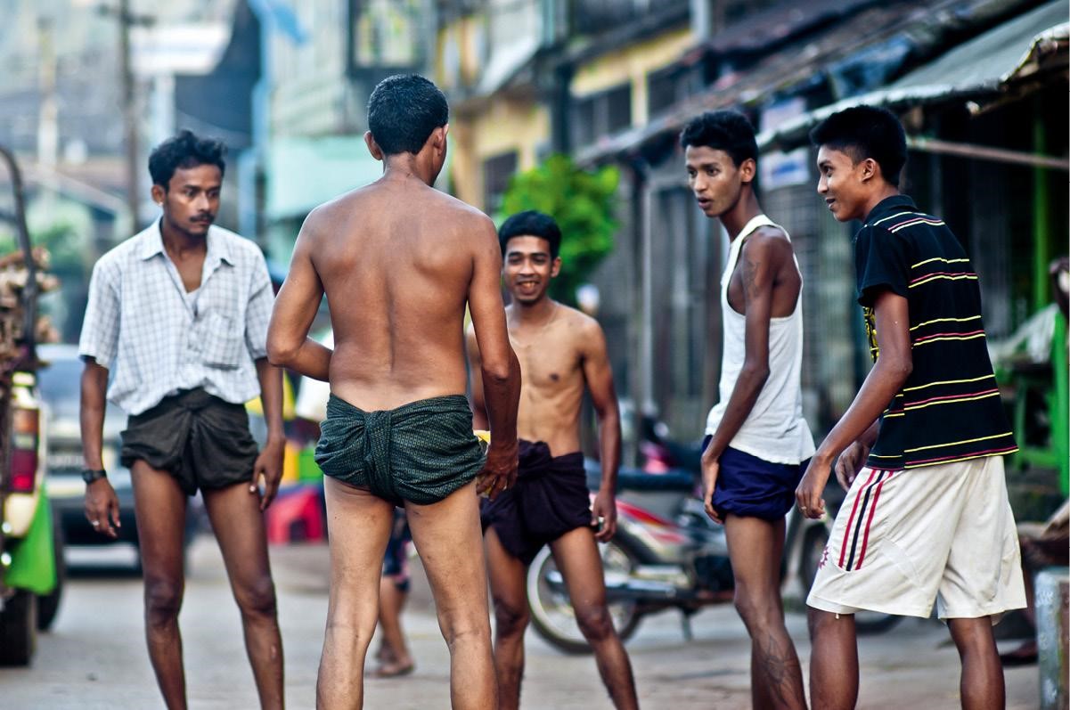 Burmese men playing kick volleyball