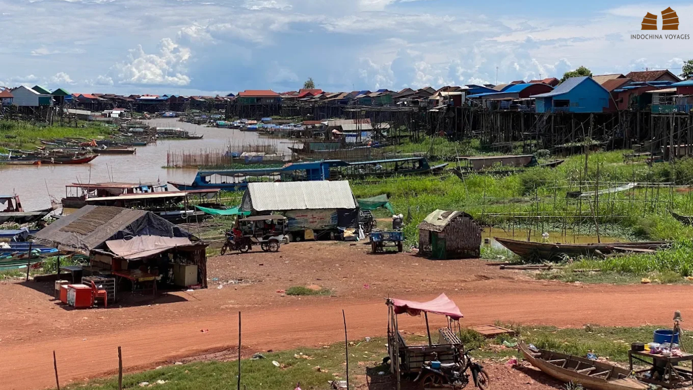 Stilt houses and moored boats along the waterfront at Kampong Khleang