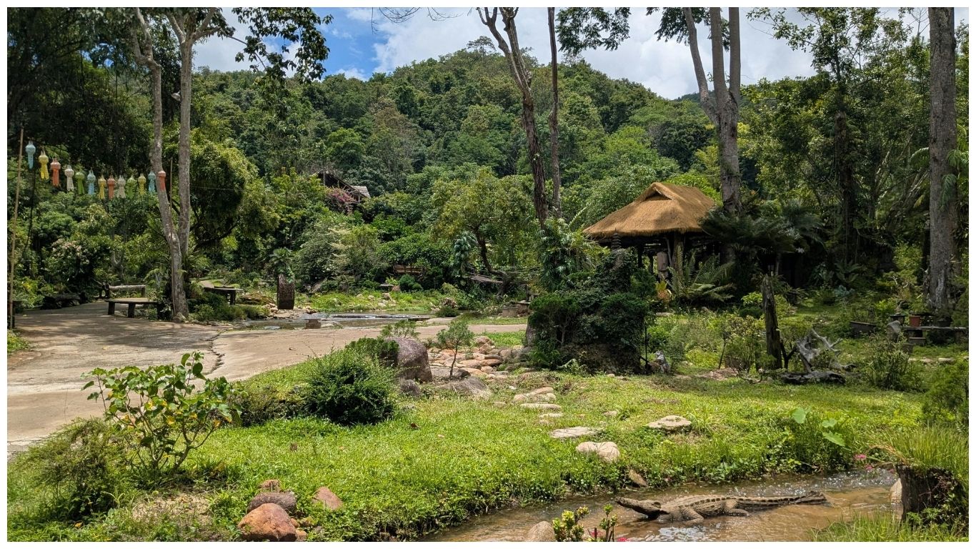A lush green garden path in a tropical Thai resort, perfect for travelers planning a trip to Thailand in June