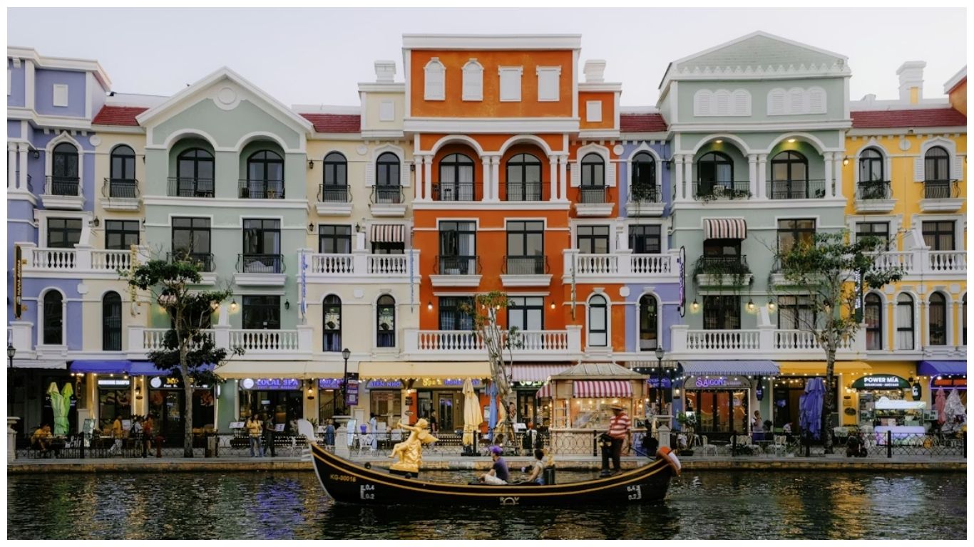 Colorful Mediterranean-style buildings and a gondola boat at Grand World, showcasing the vibrant atmosphere during the best time to visit Phu Quoc