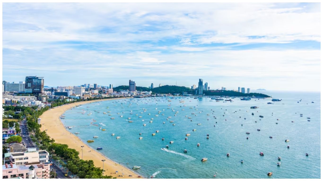 An aerial view of the Vung Tau coastline with a sandy beach and blue water, a popular coastal escape for day trips from Saigon