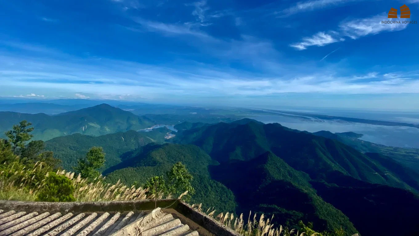 View from a Bach Ma summit viewpoint over forested ridges toward the Hue coastline